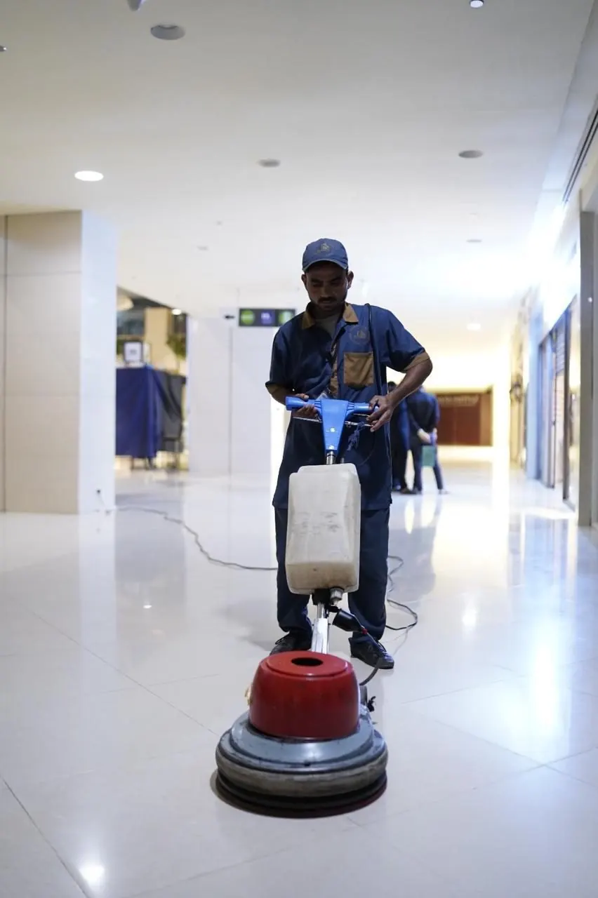 Floor polishing machine in use by Feroza staff
